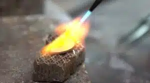 melting gold with blow torch